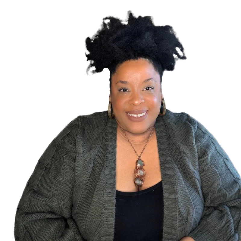 Ivy Felicia, creator of the Body Relationship&reg; Method, smiling in a green cable-knit cardigan